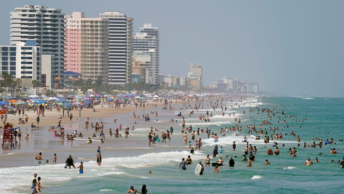 Beachgoers pack the sands in Daytona Beach, Saturday, Sept. 5, 2020.       