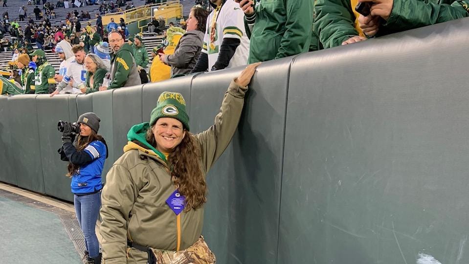 Cheesehead fans of the Green Bay Packers football team come out in droves  with their head gear and bratwursts to support the team in Green Bay,  Wisconsin - digital file from original