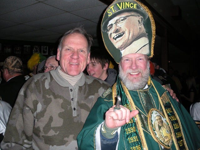 Cheesehead fans of the Green Bay Packers football team come out in droves  with their head gear and bratwursts to support the team in Green Bay,  Wisconsin - digital file from original