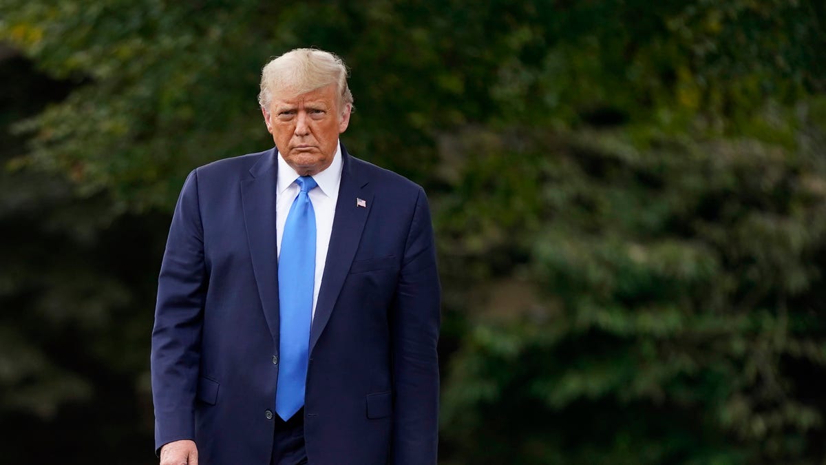 President Donald Trump walks to speak to members of the press on the South Lawn of the White House in Washington, Thursday, Sept. 24, 2020, before boarding Marine One for a short trip to Andrews Air Force Base, Md. Trump is traveling to North Carolina and Florida. (AP Photo/Patrick Semansky)