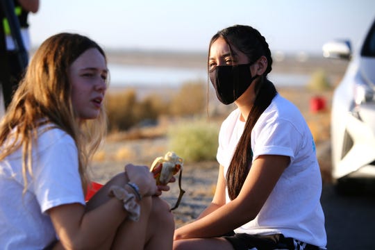 Layton Jones, 17, left, of Palm Desert High School and Evelyn Garcia, 17, of Desert Mirage High School became friends over their shared efforts to raise public awareness of the Salton Sea. The two along with Jones' brother kayaked across the Salton Sea from Desert Shores, Calif., on September 26, 2020.