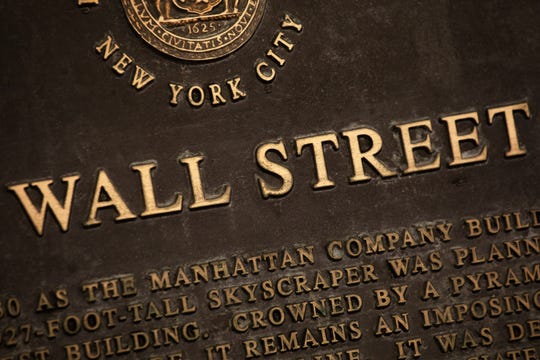 A historic marker for Wall Street is shown in New York's financial district.