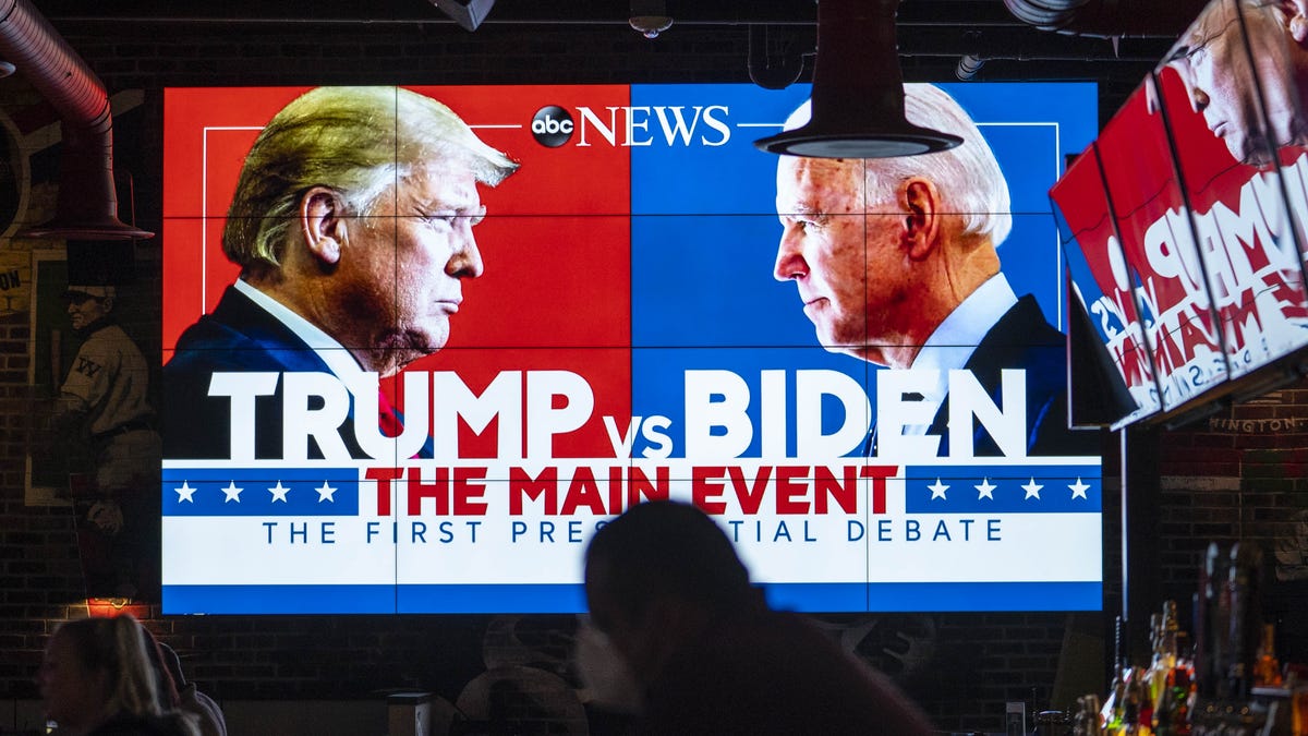 Television screens airing the first presidential debate are seen at Walters Sports Bar in Washinton.