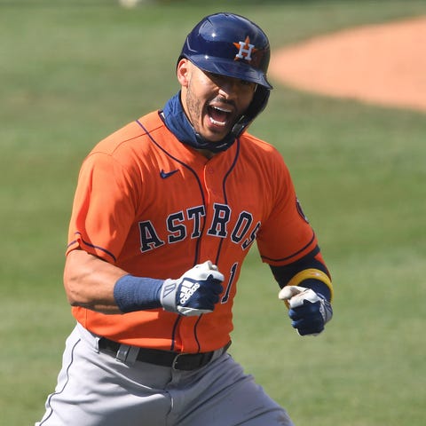 Carlos Correa celebrates his two-run home run in t