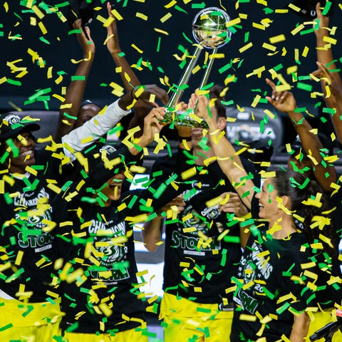 Members of the Seattle Storm celebrate with the ch