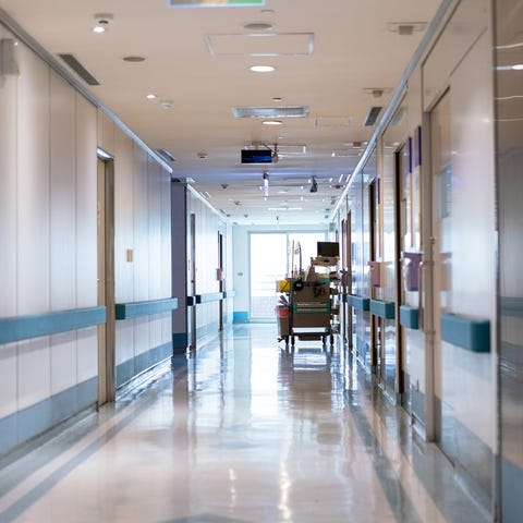 Reflection on flooring in empty corridor. Medical 