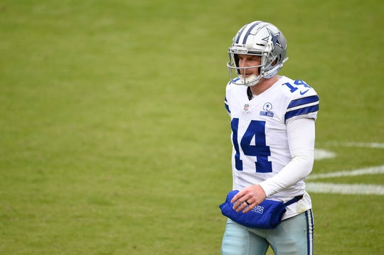 Quarterback Andy Dalton #14 of the Dallas Cowboys reacts against the Washington Football Team in the first half at FedExField on October 25, 2020 in Landover, Maryland.