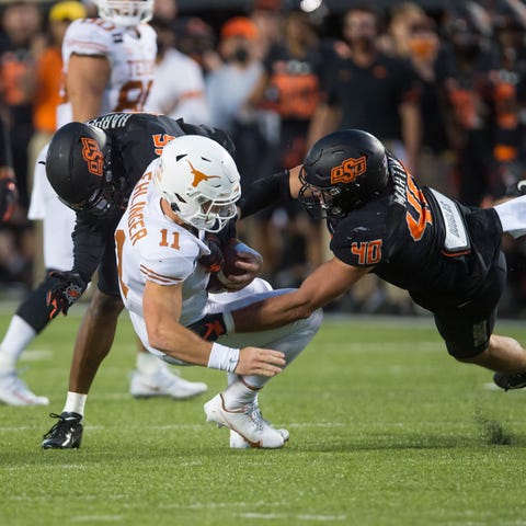 Oklahoma State defensive end Brock Martin (40) and