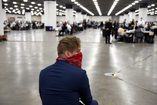 Election watcher Tim Griffin, Virginia, watches as Detroit absentee ballots are processed at TCF Center, Tuesday, Nov. 3, 2020. "There's been a lot of problems with the process so far," said Griffin, a member of the Thomas More Society.