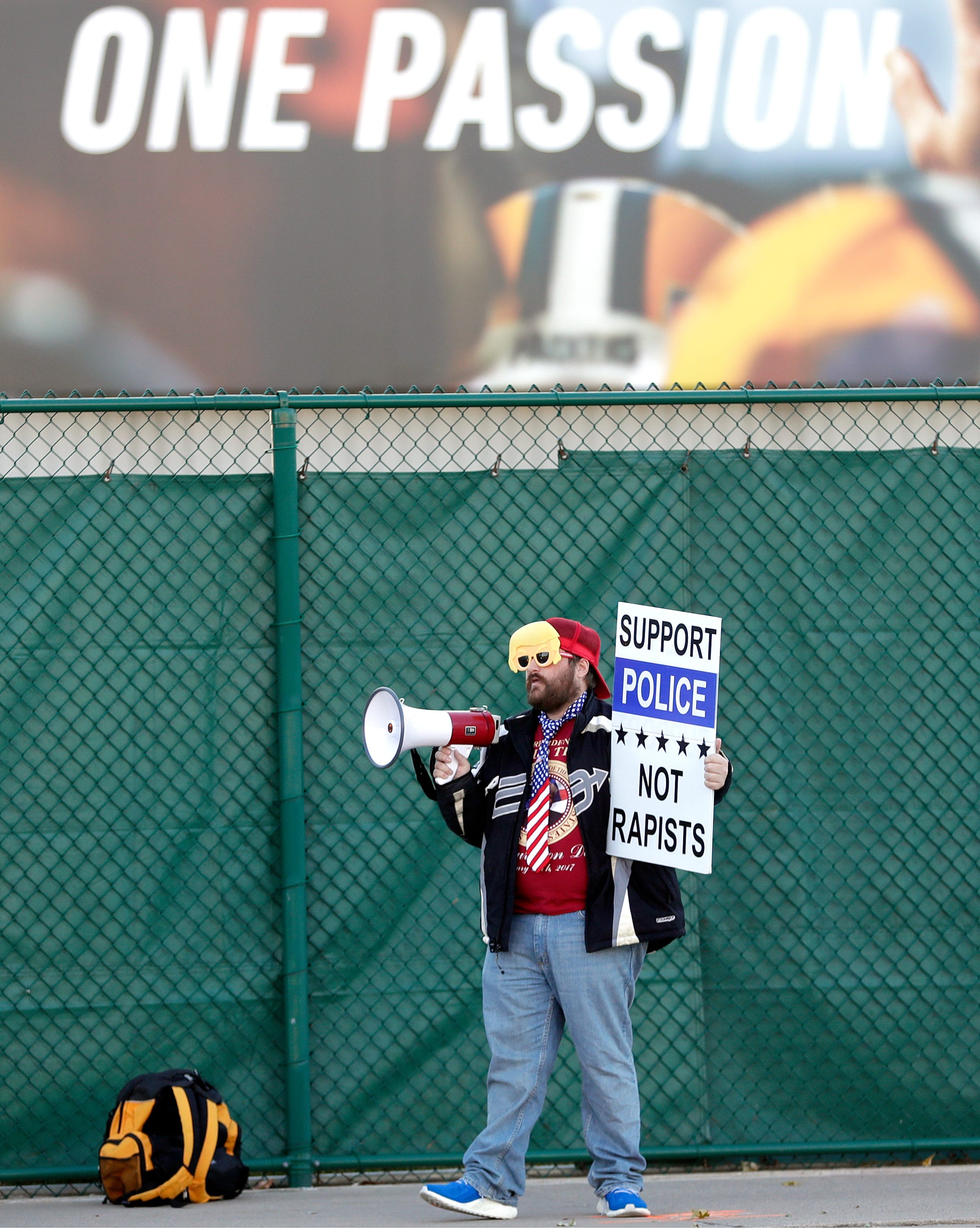 Man protests Packers' decision to open Johnsonville Tailgate Village as a  polling place.