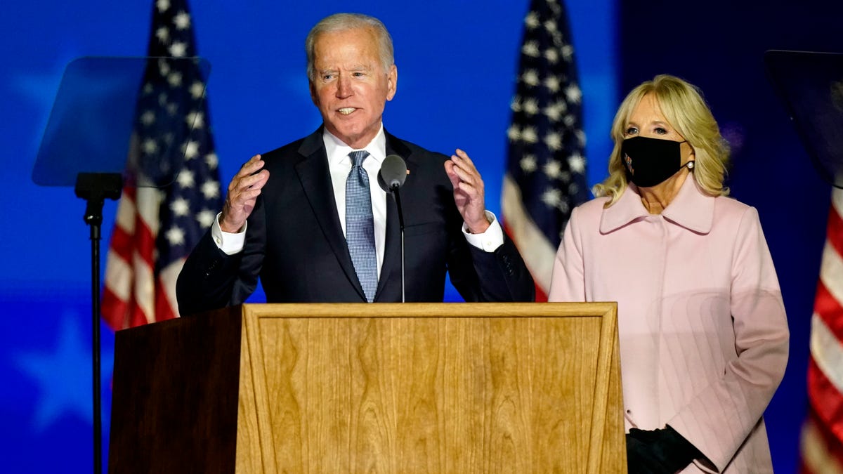 Democratic presidential candidate former Vice President Joe Biden speaks to supporters Wednesday, Nov. 4, 2020, in Wilmington, Del., as he stands next to his wife Jill Biden. (AP Photo/Andrew Harnik)