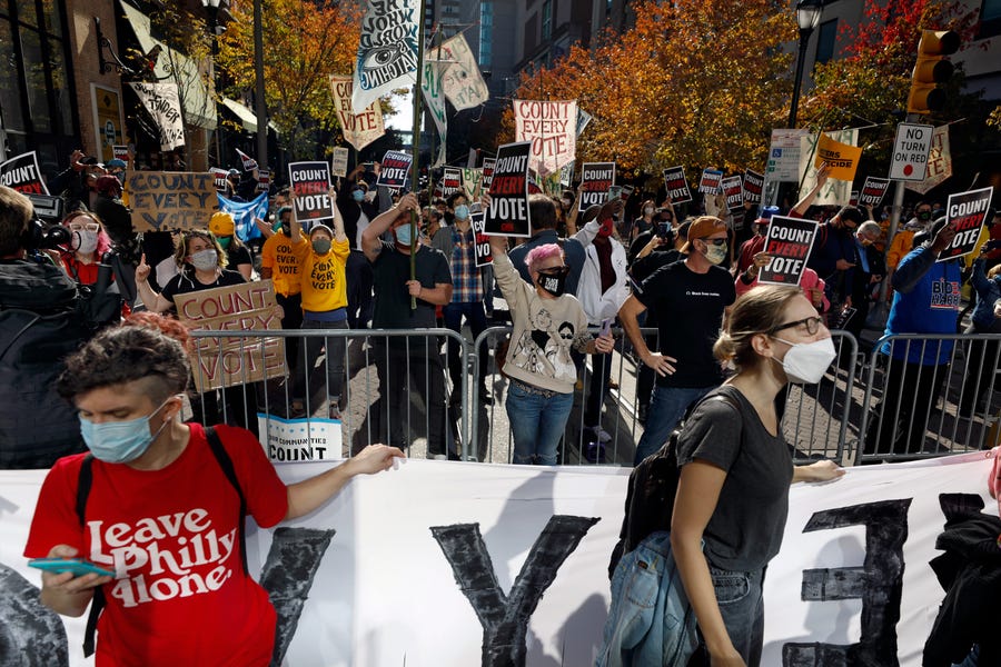 Demonstrators call for all votes be counted as they demonstrate outside the Pennsylvania Convention Center, Thursday, Nov. 5, 2020, in Philadelphia, as vote counting in the general election continues.