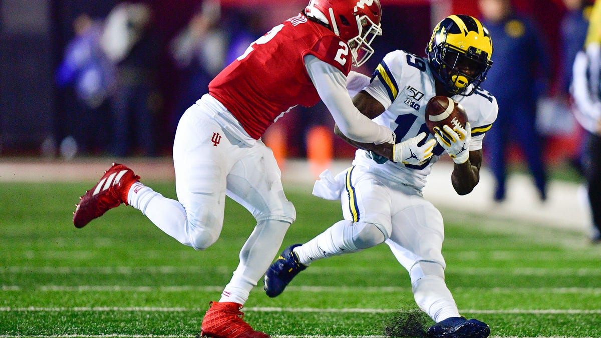 Michigan wide receiver Mike Sainristil catches a pass while being defended by Indiana defensive back Reese Taylor during their 2019 game at Memorial Stadium.