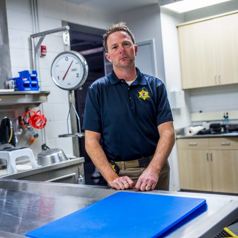 Peoria County Coroner Jamie Harwood stands in the 