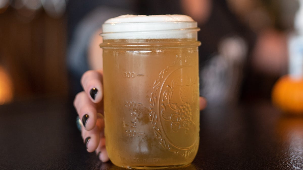 Marla Hedworth places a freshly-poured beer on the bar at Laurentide Beer Company on Thursday, Nov. 12, 2020.