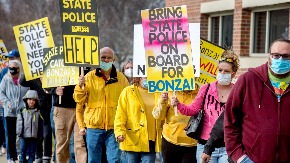 About 50 protesters march around the Pekin Police Department and Tazewell County Justice Center on Saturday, Nov. 21, 2020 demanding that the Robert "Bonzai" Bee murder case be handed over to the Illinois State Police. Filmmaker Ash Patino, who has made a multi-episode documentary about the Bee case, led the protest. The skeletal remains of Bee, 13, were found in July of 2017 after he went missing in November of 2016.