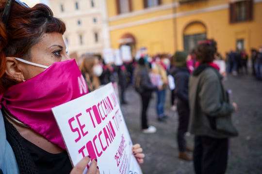 Women take part in a demonstration on the International Day for the Elimination of Violence against Women, in Rome, Wednesday, Nov. 25, 2020.