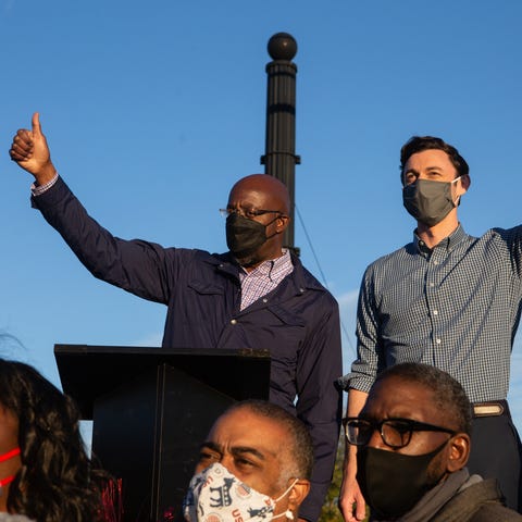 Democratic Senate candidates Jon Ossoff, right, an