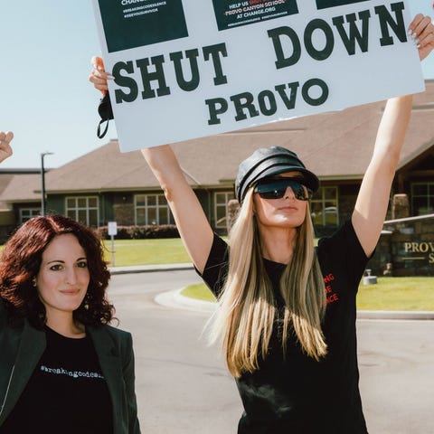 Jen Robinson (left) and Paris Hilton (right) stand