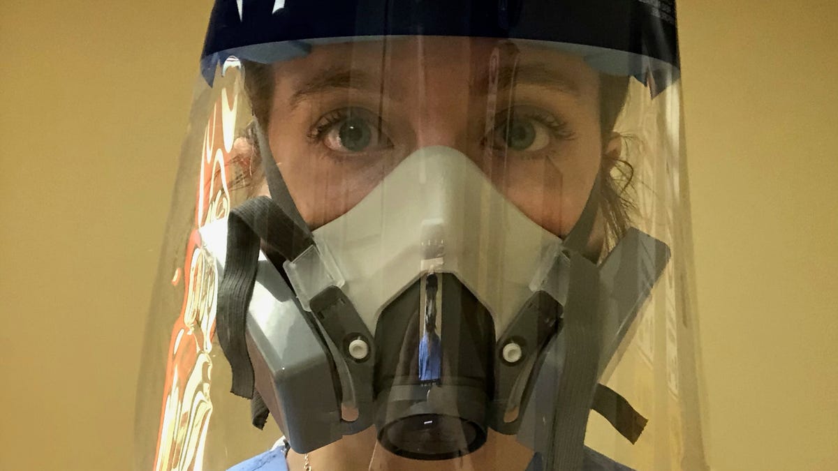 Kathryn Ivey, who works as a registered nurse in an intensive care unit at a Nashville hospital, poses for a selfie after a shift in the personal protective equipment she wears daily.