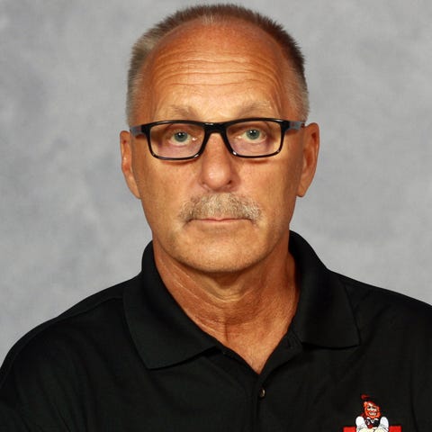 Monmouth College swim coach Tom Burek died on the 