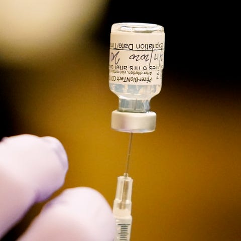 A COVID-19 Pfizer-BioNTech Vaccine is readied at E