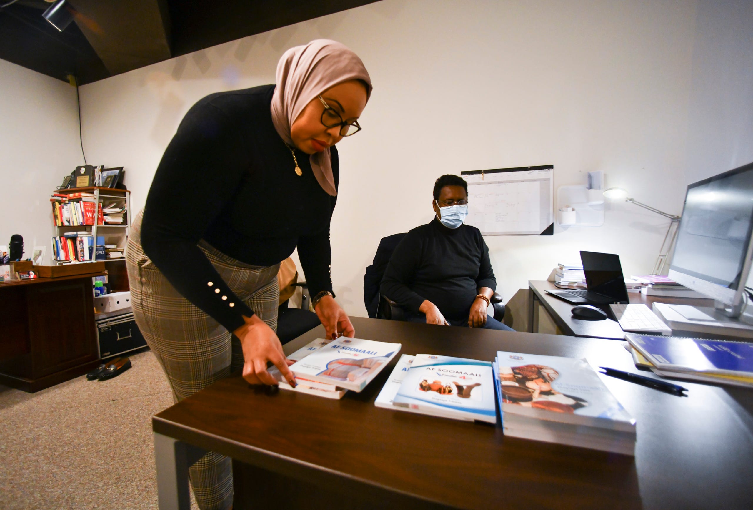 Hudda Ibrahim talks about textbooks to be used in a new Somali language curriculum Tuesday Dec. 15, 2020, at Filsan Talent Partners in St. Cloud.