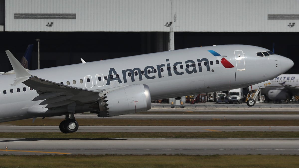 American Airlines Flight 718, a Boeing 737 Max, takes off from Miami International Airport on its way to New York on Dec. 29. The Boeing 737 Max flew its first commercial flight since the aircraft was allowed to return to service nearly two years after being grounded worldwide following a pair of crashes.