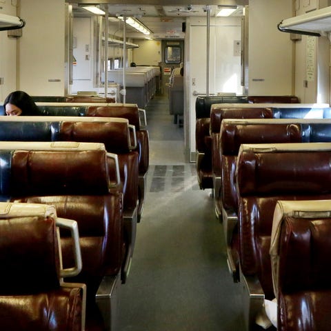 Passengers ride a sparsely occupied Hudson Line Me