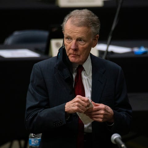 Illinois House Speaker Michael Madigan walks on th