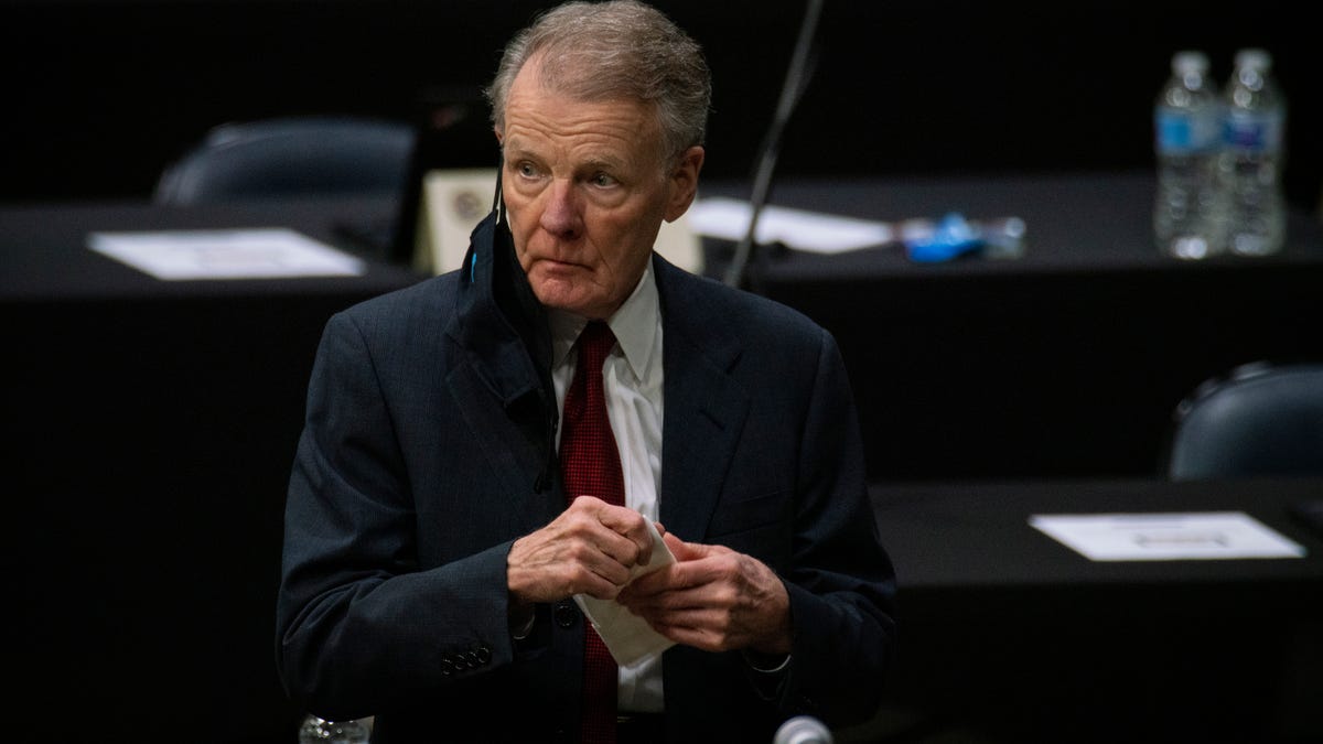 Illinois House Speaker Michael Madigan walks on the floor as the Illinois House of Representatives convenes at the Bank of Springfield Center, Friday, Jan. 8, 2021, in Springfield, Ill. (E. Jason Wambsgans/Chicago Tribune via AP)