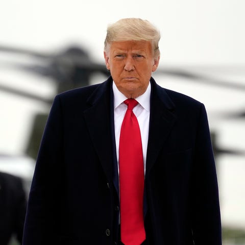 President Donald Trump boards Air Force One upon a