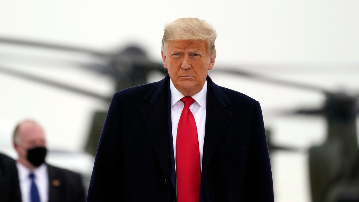 President Donald Trump boards Air Force One upon arrival at Valley International Airport, Jan. 12, 2021, in Harlingen, Texas, after visiting a section of the border wall with Mexico in Alamo, Texas.