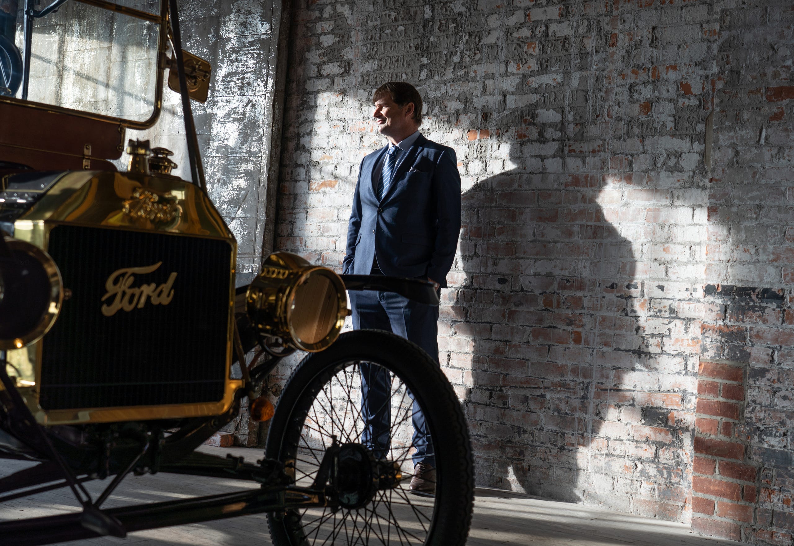 Ford Motor Company CEO Jim Farley stands in a room with Model T vehicles at the Ford Piquette Avenue Plant in Detroit on Jan. 14, 2021.