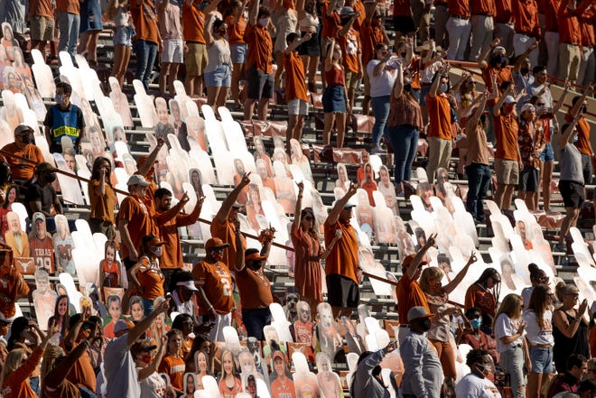 Texas fans sing "The Eyes of Texas" after the Longhorns' 17-13 win over West Virginia at Royal-Memorial Stadium in November. Due to COVID-19 restrictions, attendance at home games was capped well below the stadium's capacity.
