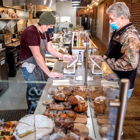 Larry Nailon, right, buys some treats from Ardor B