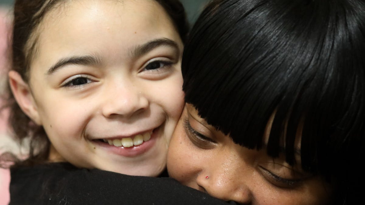 Kendra Smith embraces her daughter Diamond Yeno at their home in City of Poughkeepsie on January 28, 2021. Kendra's life has been deeply impacted by gun violence and loss, but she has overcome her challenges and works every day to protect her daughter from experiencing similar loss. 