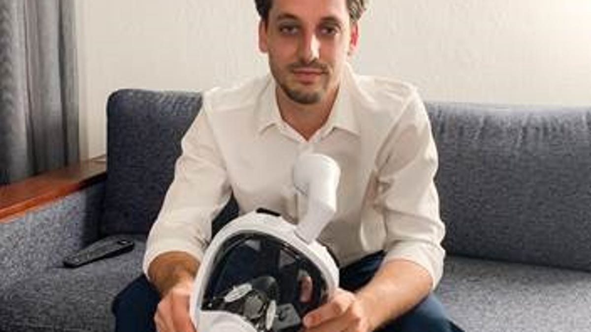 Rob Joseph holds the mask he was told to removed while boarding a United Airlines flight out of Newark Airport.