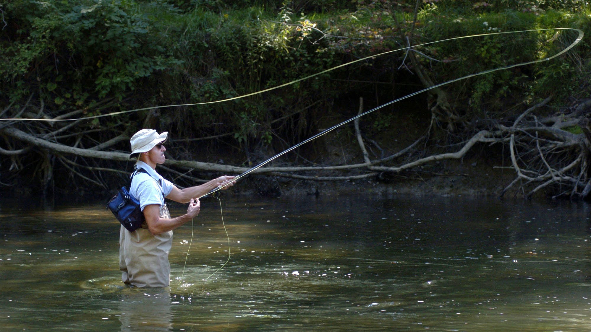 Mark Deka, of Cambridge Springs, casts his fly rod along a section of French Creek near Saegertown on Sept. 2, 2008. He was fishing for smallmouth bass.