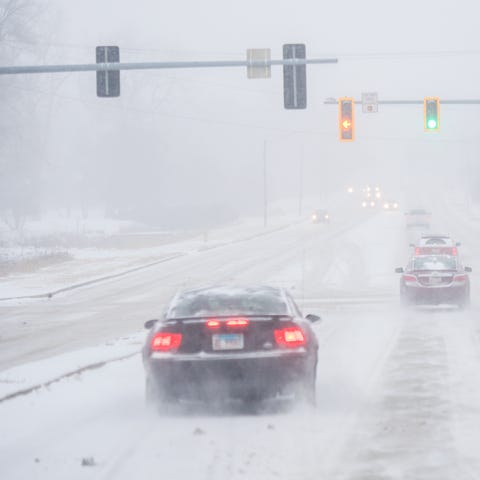 Drivers make their way up Knoxville Avenue as a st