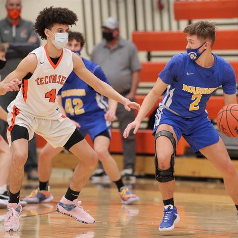 Tecumseh's TJ Bell guards Madison's Max Palpant du