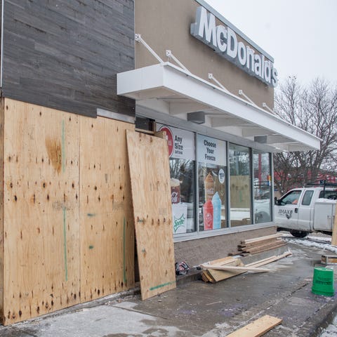 Workers have begun boarding up a section of McDona