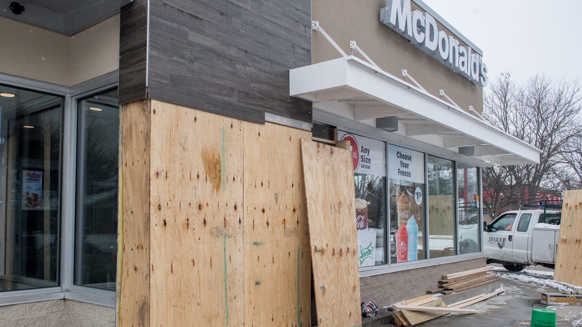 Workers have begun boarding up a section of McDonald’s, 627 N. Western Ave., on Wednesday, Feb. 17, 2021 that was struck by a Peoria Police squad car earlier that morning.