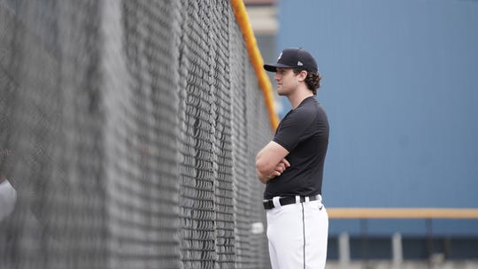 Tigers pitcher Casey Mize watches his teammates during workouts Wednesday in Lakeland, Florida.