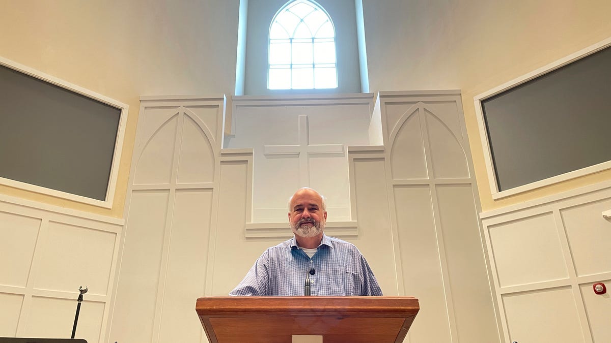 Pastor Jim Conrad stands in the Towne View Baptist Church on Feb. 18 in Kennesaw, Ga. In its 2021 meeting, the Southern Baptist Convention's executive committee voted to oust the church for allowing LGBTQ people to become members of its congregation.