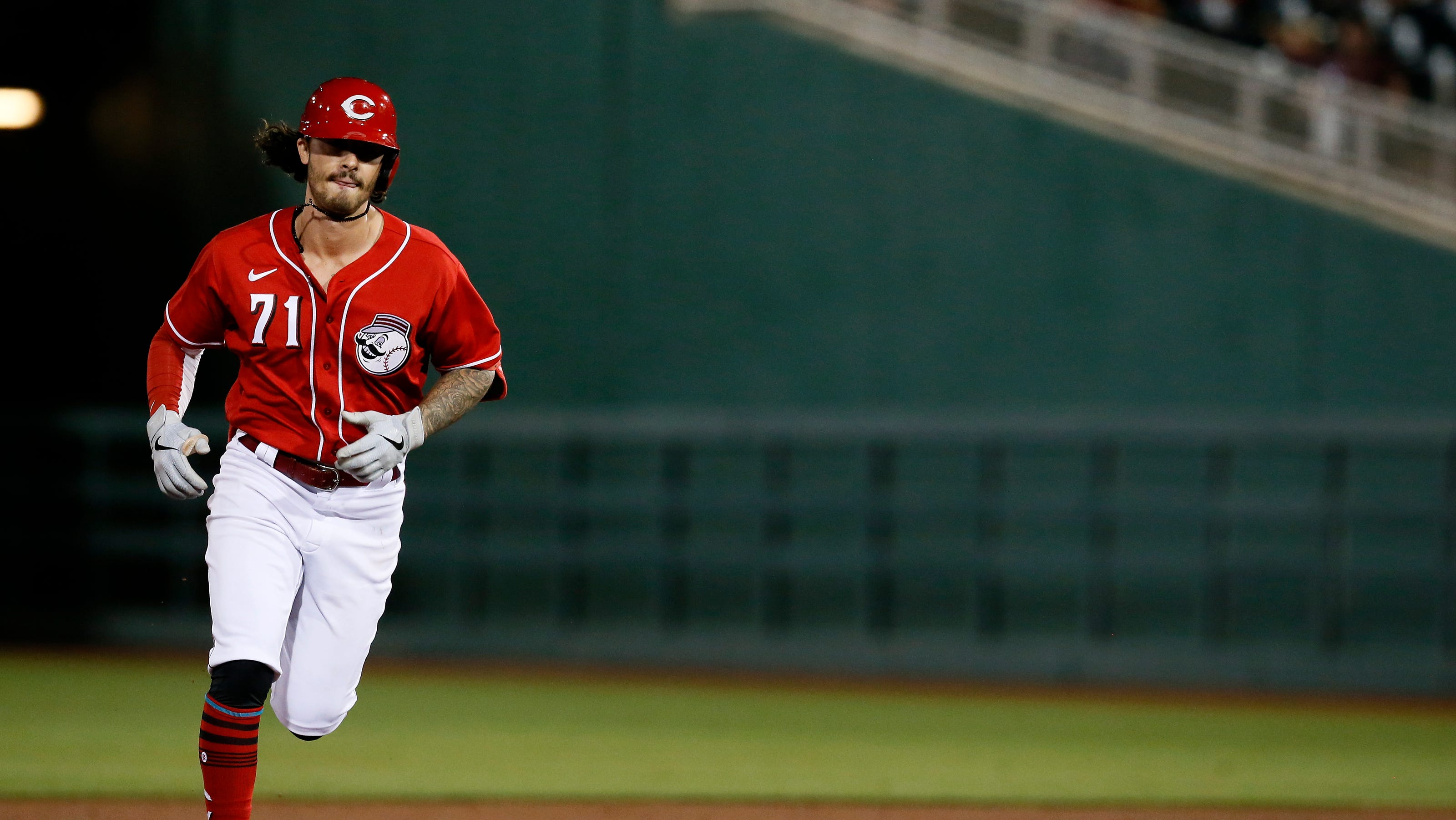 Cincinnati Reds cut 11 players from camp, promote Jonathan India