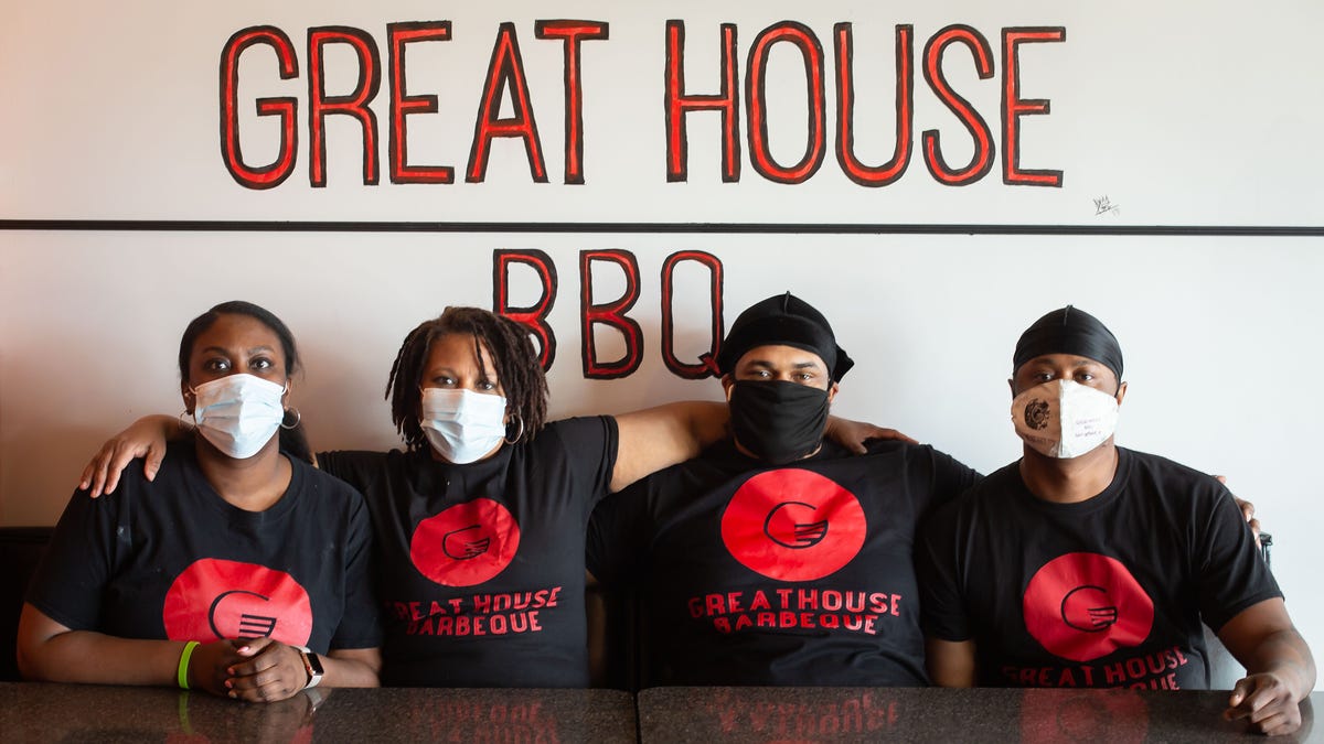 It’s a family affair for Great House BBQ with Di’Anna Mitchell, left, mother, Renatta Dunigan, and brothers Benjamin Frazier and Kurtis Mitchell, right, that are partners in the BBQ restaurant at 4233 Wabash Ave. The restaurant faced tough times through the COVID-19 pandemic, but found help through the generosity of donations from a GoFundMe campaign that was started by a friend of Renatta Dunigan. [Justin L. Fowler/The State Journal-Register]