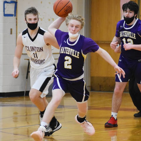 Waterville's Tyson Maxam throws an outlet pass to 