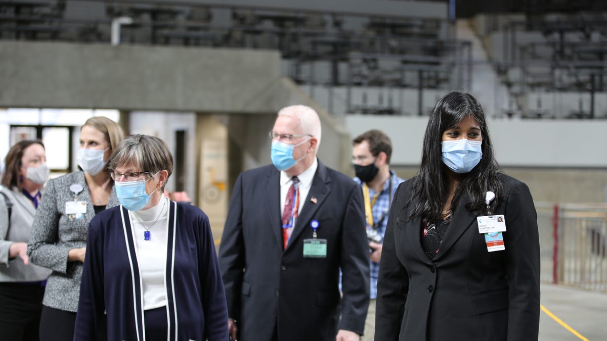 Gov. Laura Kelly (left) tours a mass vaccination site at the Stormont Vail Events Center with Dr. Lee Norman, secretary of health and environment, and Dr. Sridevi Donepudi, a senior vice president and chief medical quality officer for Stormont Vail Health.
