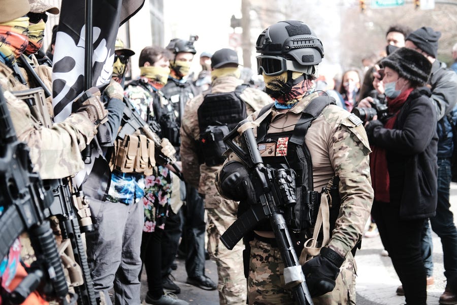 Members of the "boogaloo boys" join other gun rights advocates in front of the State House as pro-gun supporters gather on January 18, 2021 in Richmond, Virginia.